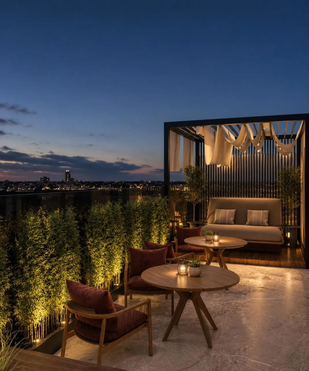 Rooftop éclairé la nuit avec pergola et salon extérieur